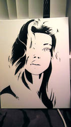 Girls face stencil painted on canvas