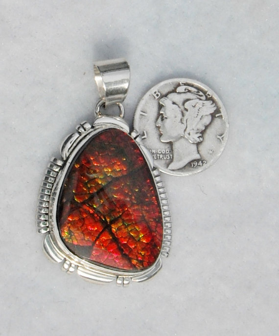 Shimering Red Ammolite Pendant.