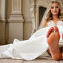 Barefoot brides posing their feet