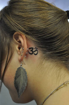 Om Symbol behind ear