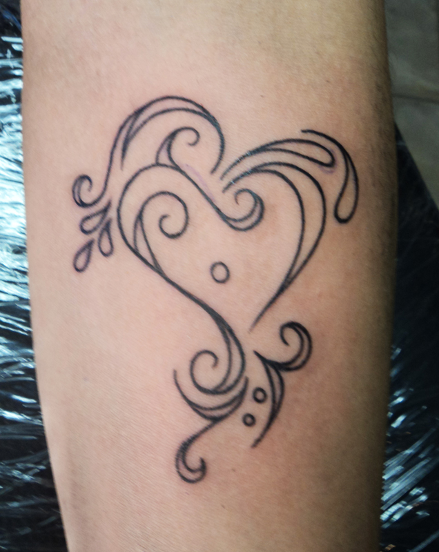 tribal heart thing tattoo