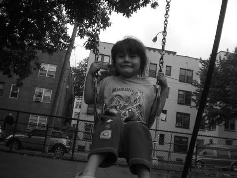 Julia on swings, smiling