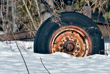 Rusty wheel stuck in the snow