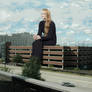 Sophie Turner sitting on a parking structure
