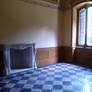 Room with  checkered floor and fireplace