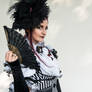 Stock - Burton lady with fan stirped dress 2