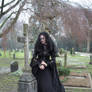 Stock - The widow and the cross stand dark veil