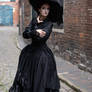 Stock - Gothic lady with a big hat stand romantic