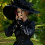 Stock - Gothic lady big hat hand to face pose