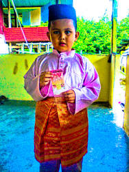 A Boy With Duit Raya