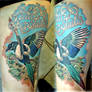 Colourful bird tattoo