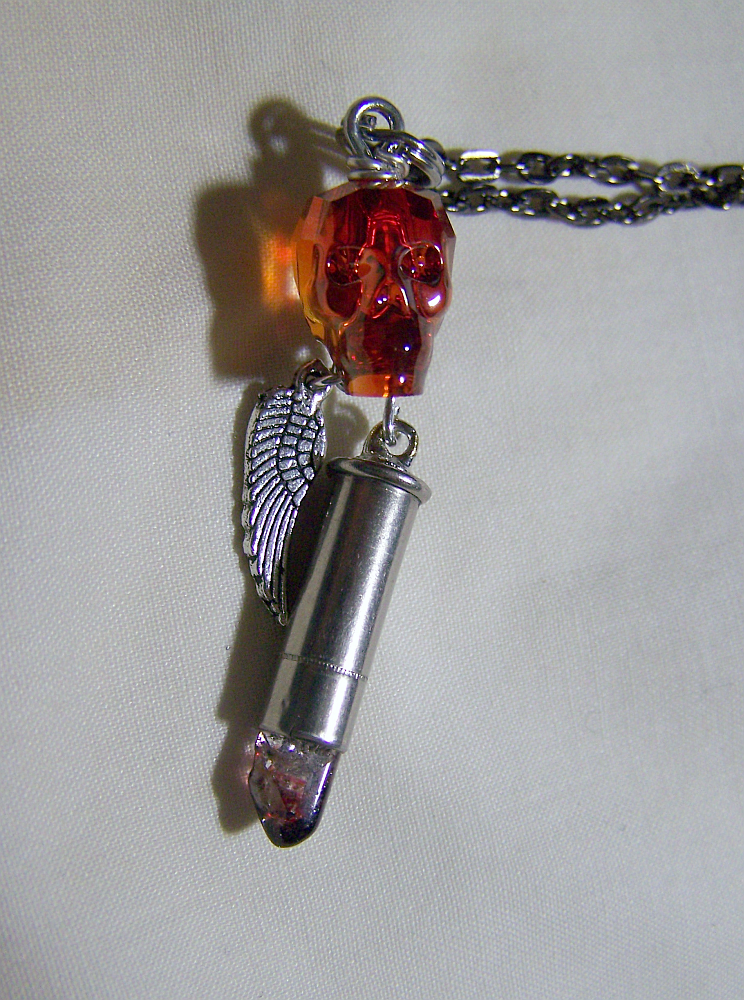 Swarovski Magma Skull with Blood Crystal Bullet