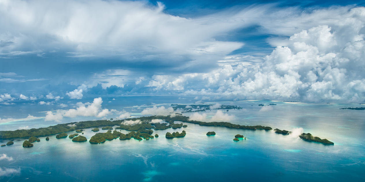 Boats approaching rock islands by MarkKenworthy on DeviantArt