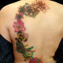 flowers on back tattoo