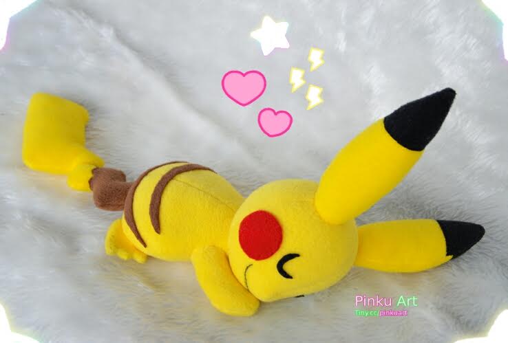 Cuddling Pikachu plushie