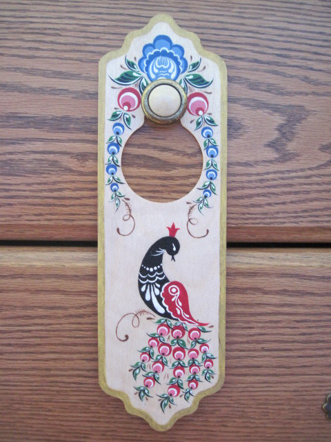 Door hanger with a peacock