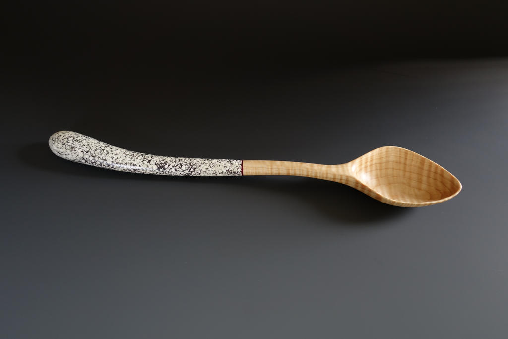 Chef's spoon with crushed eggshell.