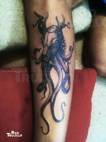 Octopus under a deer's skull tattoo