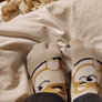 My socked feet gripping the blanket GIF