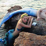 Merman and Mermaid on the rocks