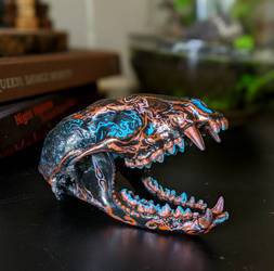 Orange and blue flamed raccoon skull