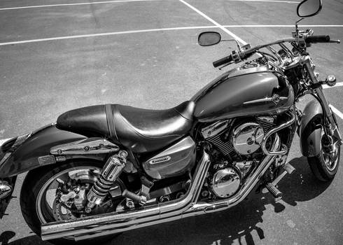 Motorcycle in parking lot bw