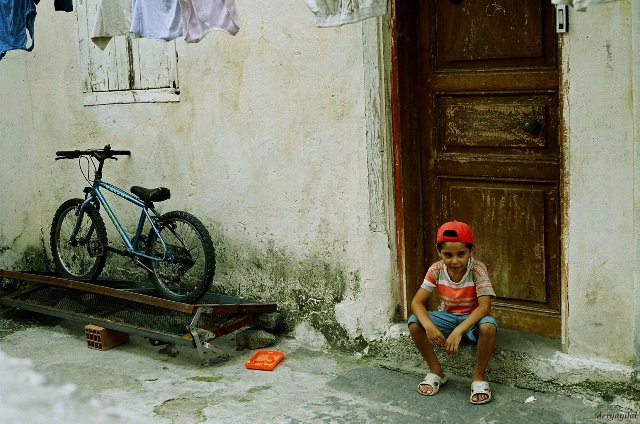 child in front of the door