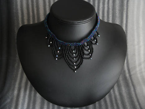graduated draped collar with black pearls