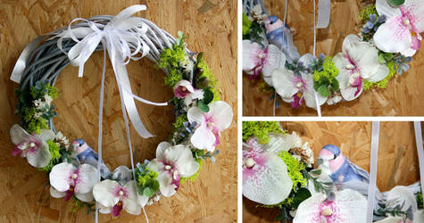 Wicker wreath with a white orchid accent and littl