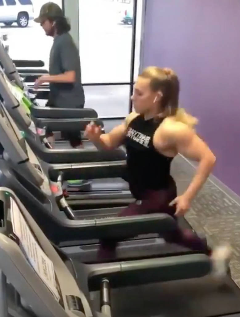 Buff girl running on treadmill sprints past guy by bigelowmax on DeviantArt