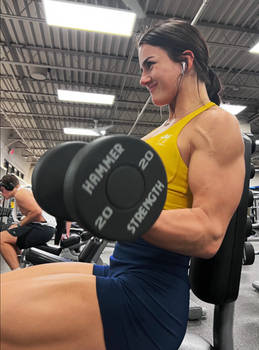 Girl Lifts Powerfully Near Out-of-Shape Guy