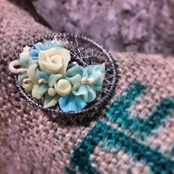 green flower brooch