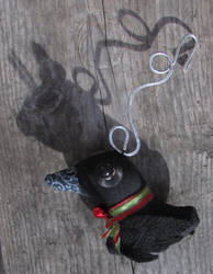 black bird with rabbit shadow ornament