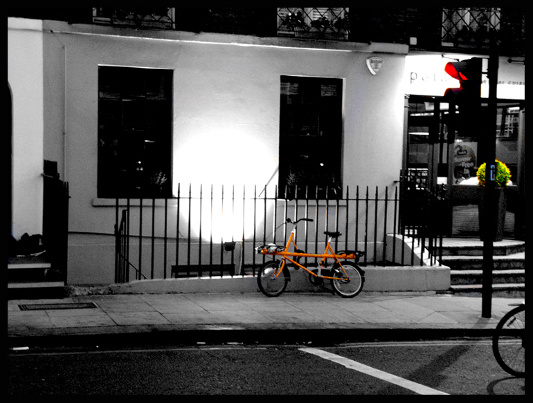 the orange bicycle..