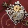 Clockwork Necklace Against Red