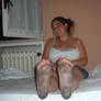 Barefoot Woman On Bed