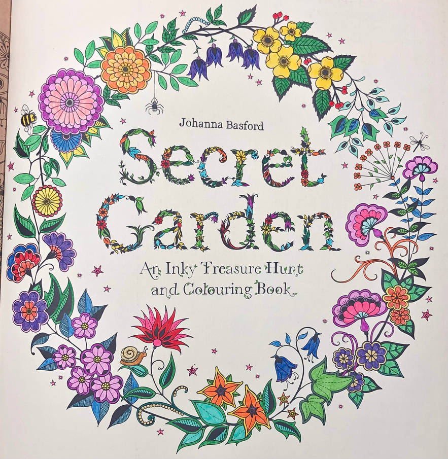 Completed pages in my first ever colouring book, Secret Garden