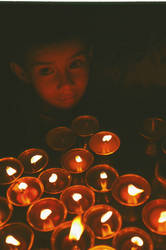 nepalese boy in candlelight