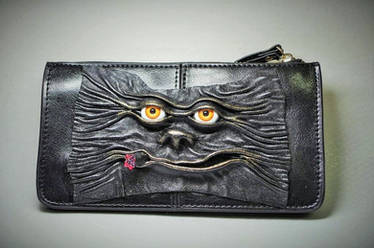 Leather clutch, wallet with leather face.