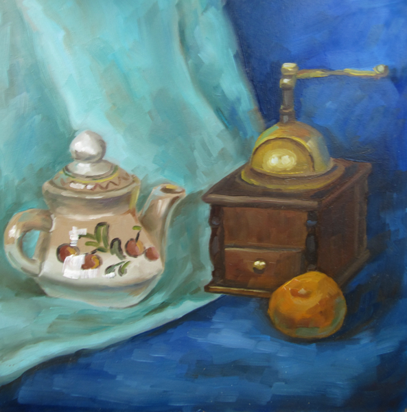 Teapot, tangerine and coffee grinder