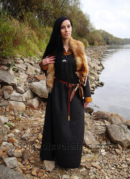 Early medieval woolen dress with silk hems