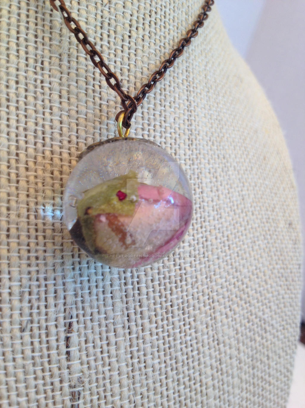 Resin sphere necklace with pink rosebud