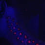 black light neck tattoo under blacklight