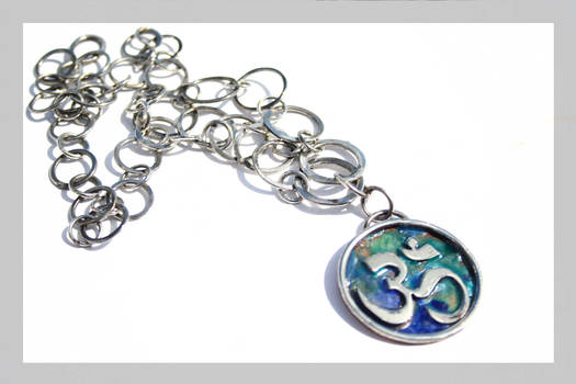 Ohm enameled pendant with handmade chain.
