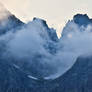 Mountain peaks hiding under evening clouds I