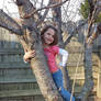 Young girl climbing a tree