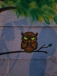 Owl with glowing eyes