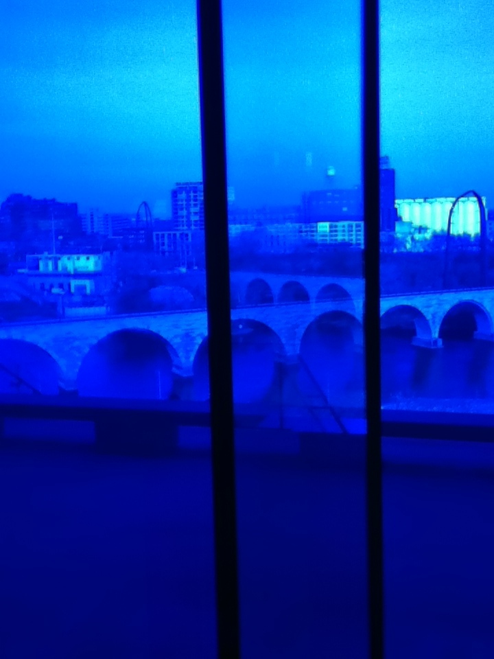 Stone Arch Bridge Through the Blue Paned Glass