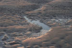 Ripples and mini stream in the sand