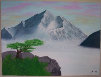 Misty mountain with tree.